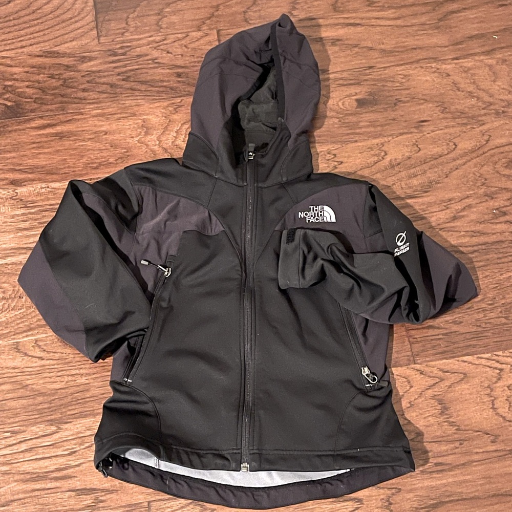 The North Face flight series black zip up with dark purple. Xsmall
